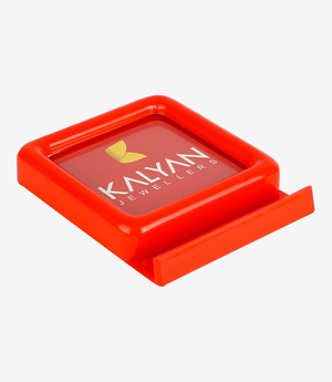 Red plastic paper weight