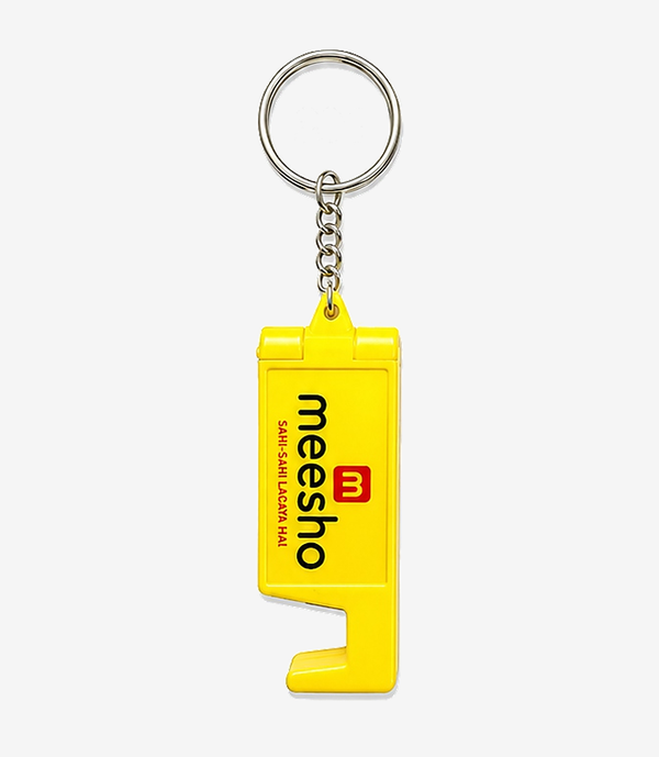 Yellow plastic keychain with a fold-out mobile stand on a split ring