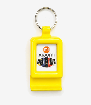 KKM-p56-06-plastic-keychain-with-mobile-stand Yellow plastic keychain with a fold-out mobile stand on a split ring