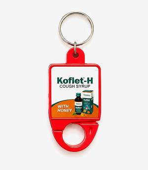Red plastic hook keychain on a metal split ring